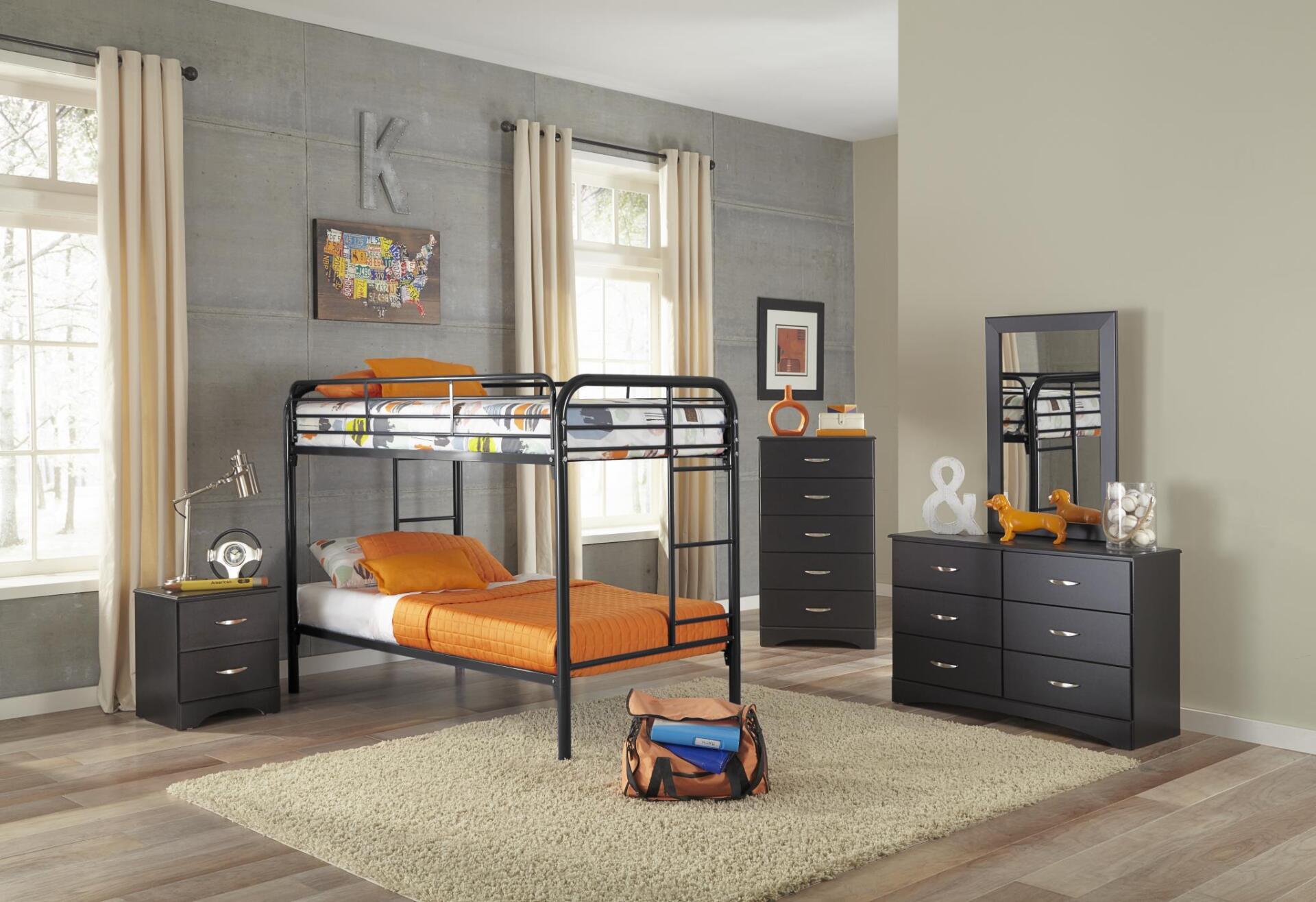 A bedroom with a bunk bed , dresser , nightstand and mirror.