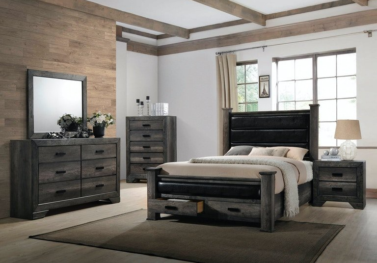 A bedroom with a bed , dresser , nightstand and mirror