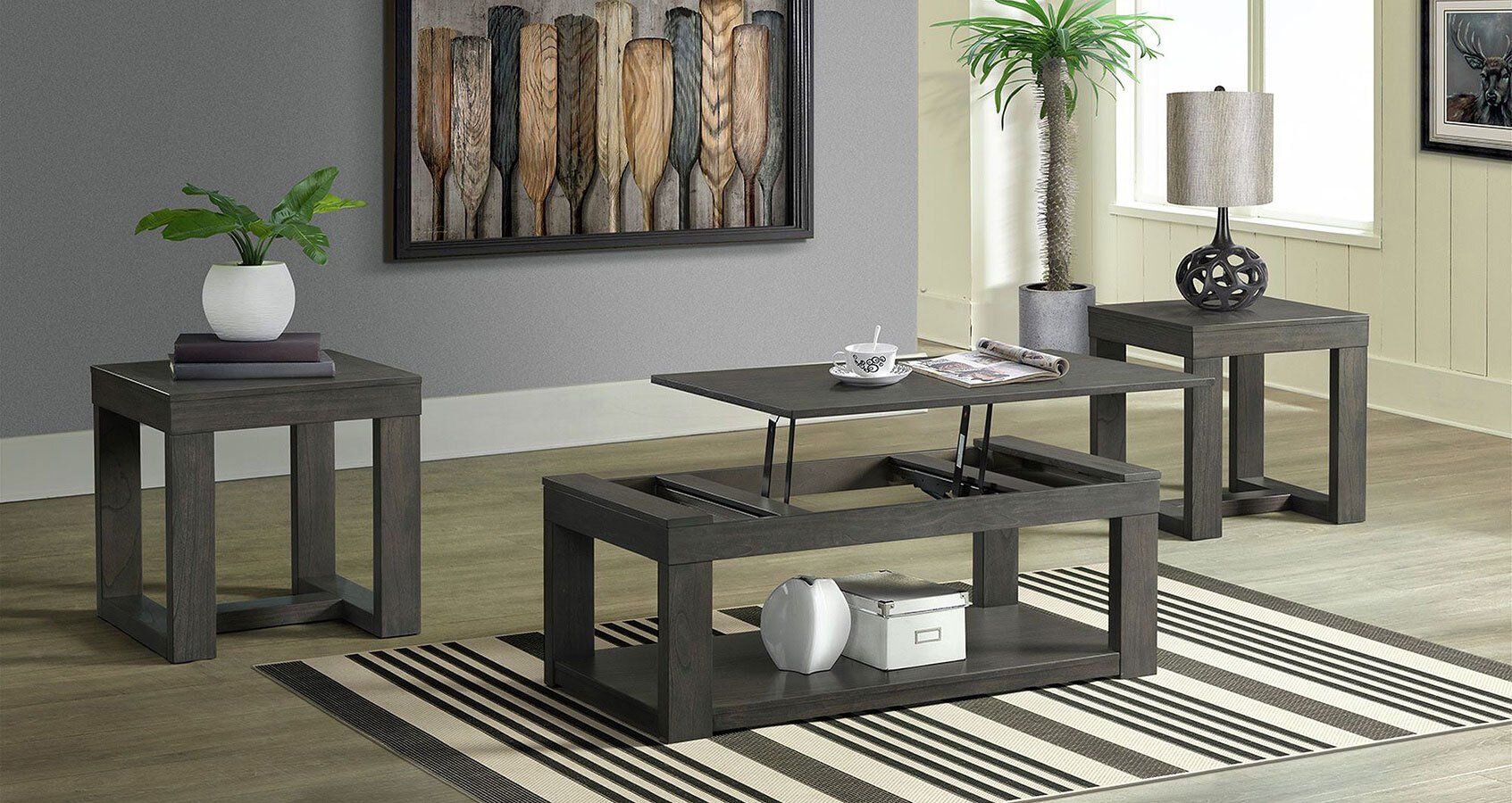 A living room with a coffee table , end tables , and a rug.