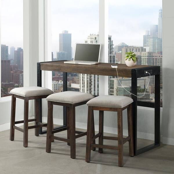 A desk with a laptop and three stools in front of a window