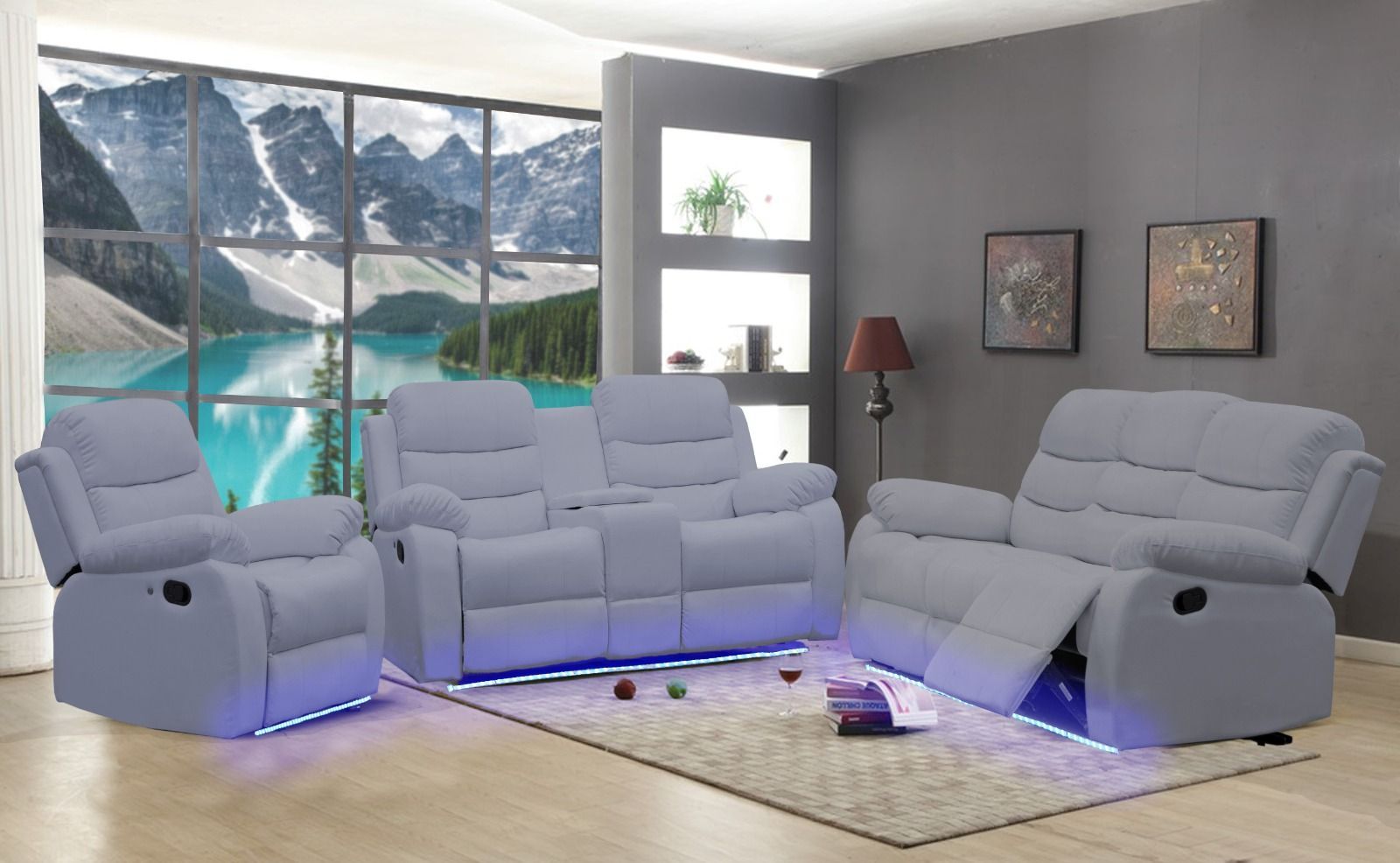 A living room with a couch , two chairs , and a rug.