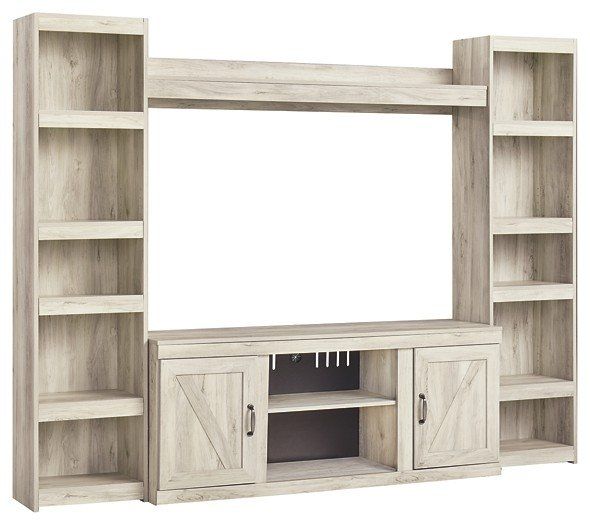 A white entertainment center with shelves and a tv stand