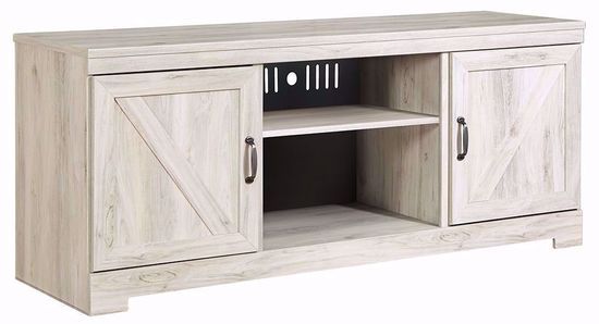 A white wooden entertainment center with sliding doors and a shelf.