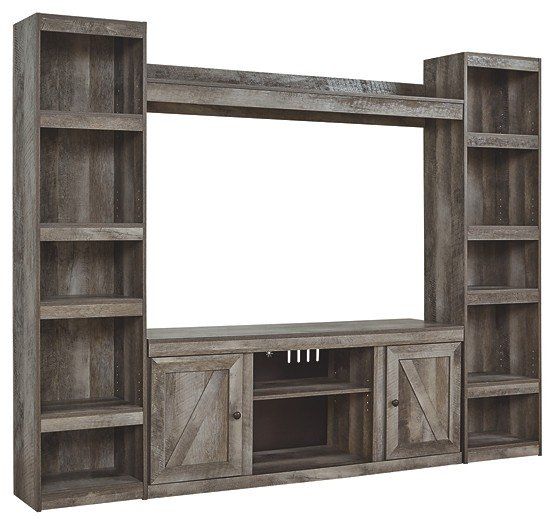 A wooden entertainment center with shelves and cabinets on a white background.