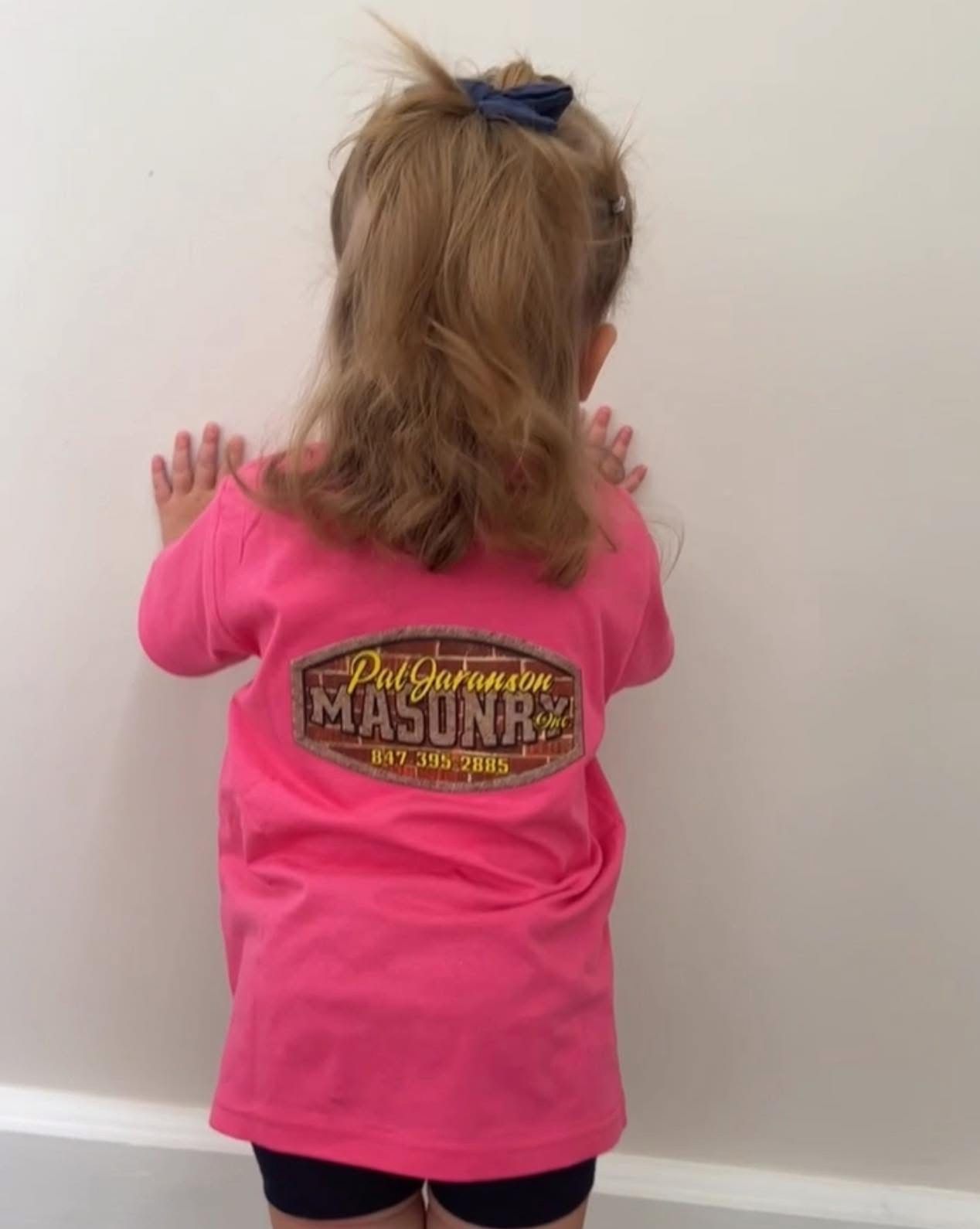 Girl in pink shirt with 