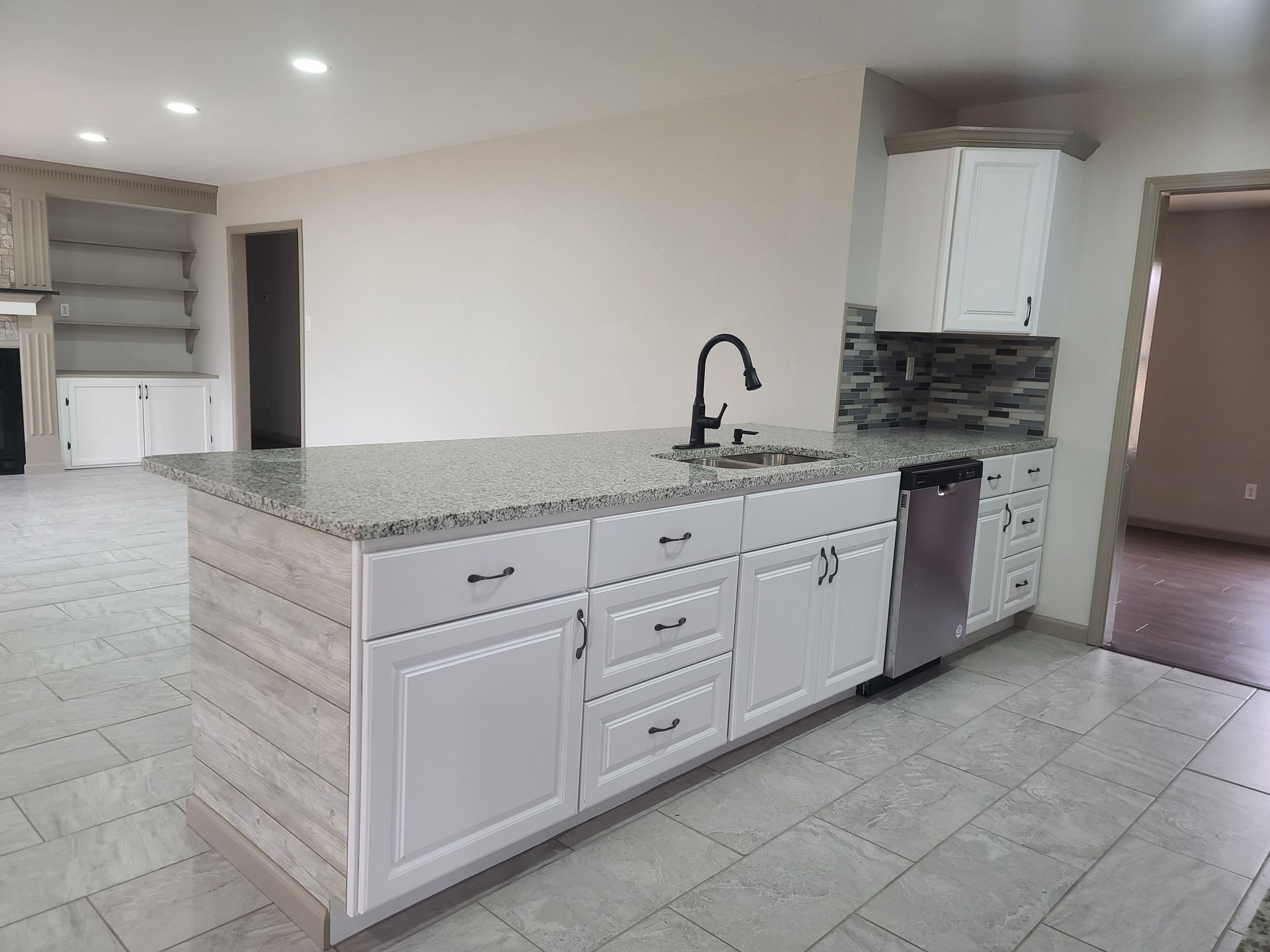 There is a large island in the middle of the kitchen.