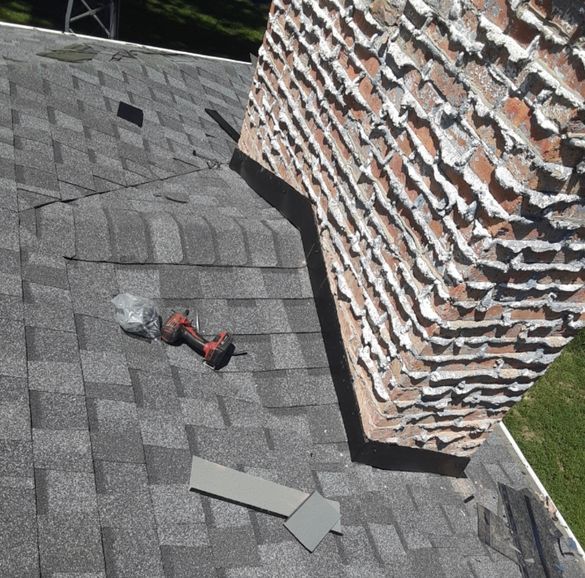 a roof with a chimney and a drill on it