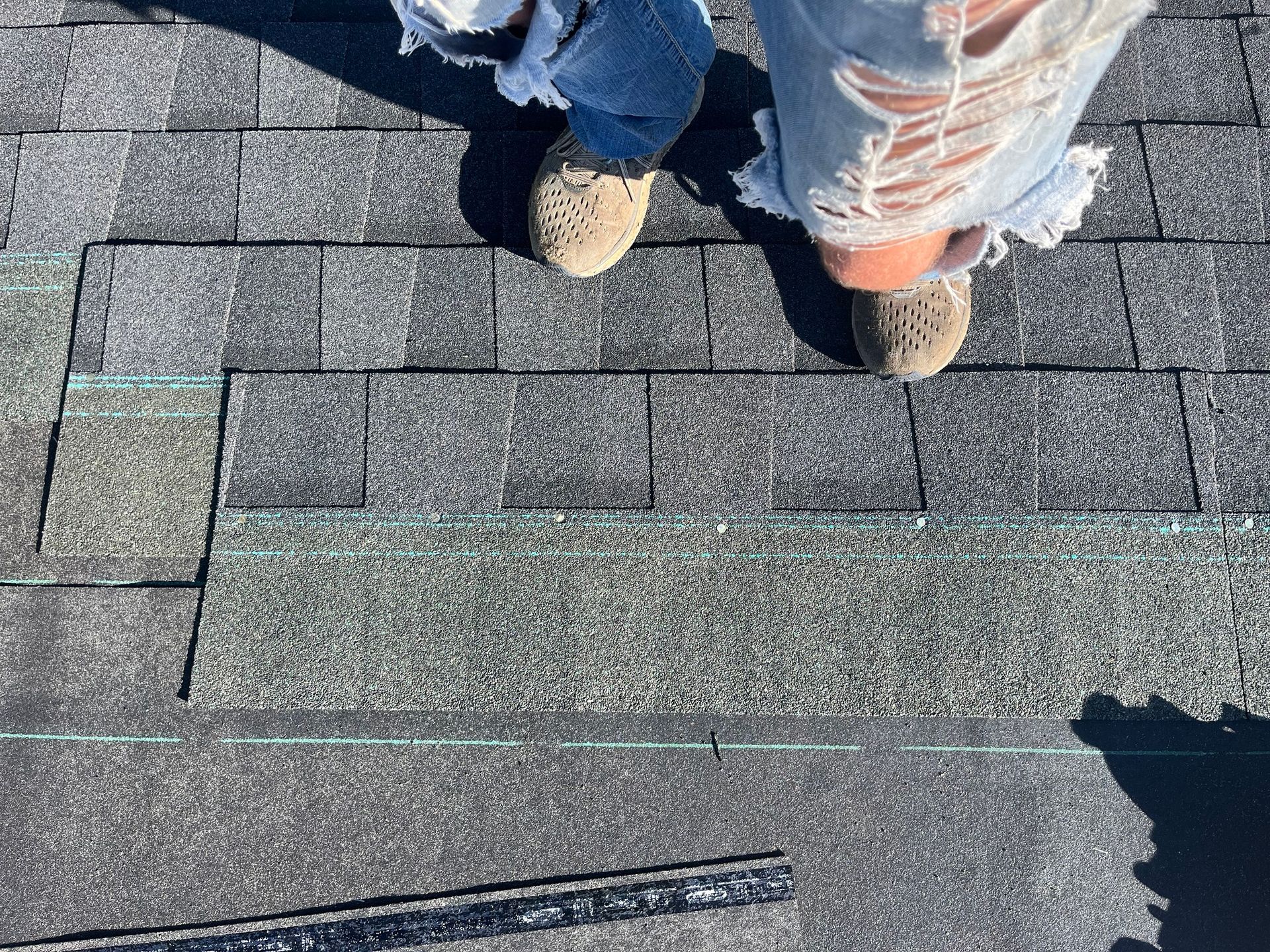 a person is standing on top of a roof