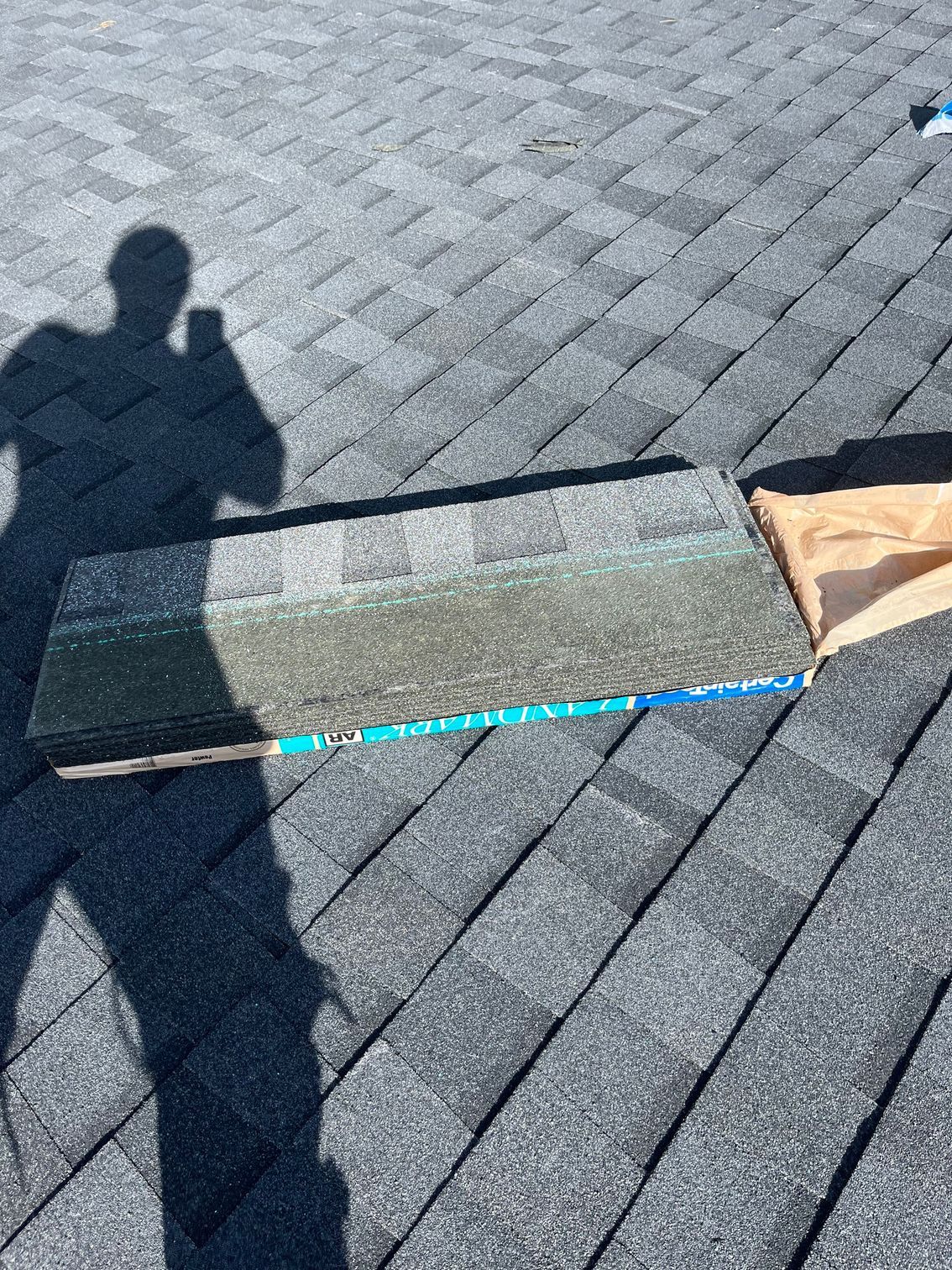 a person is taking a picture of a roof