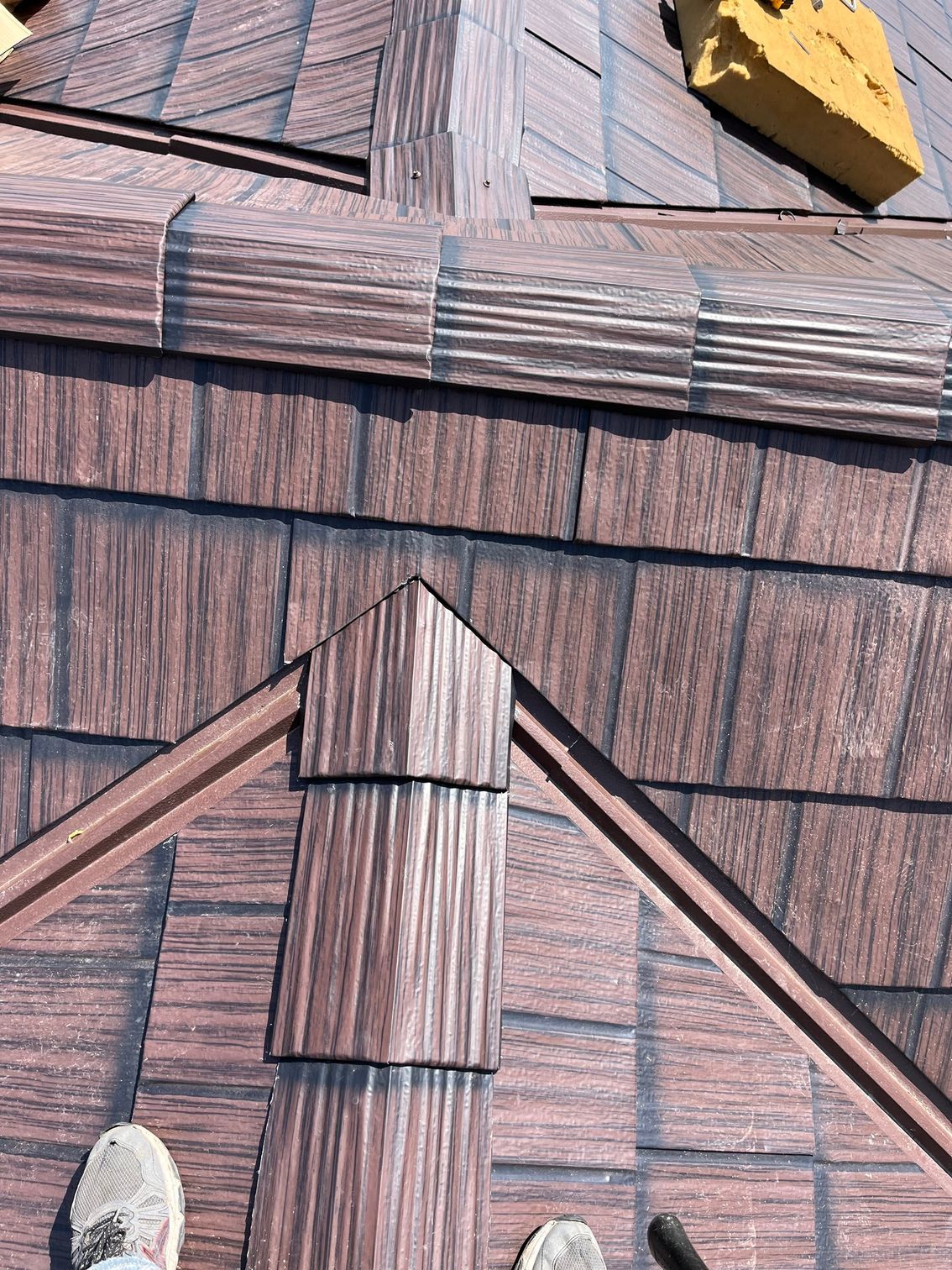 a person standing on top of a roof
