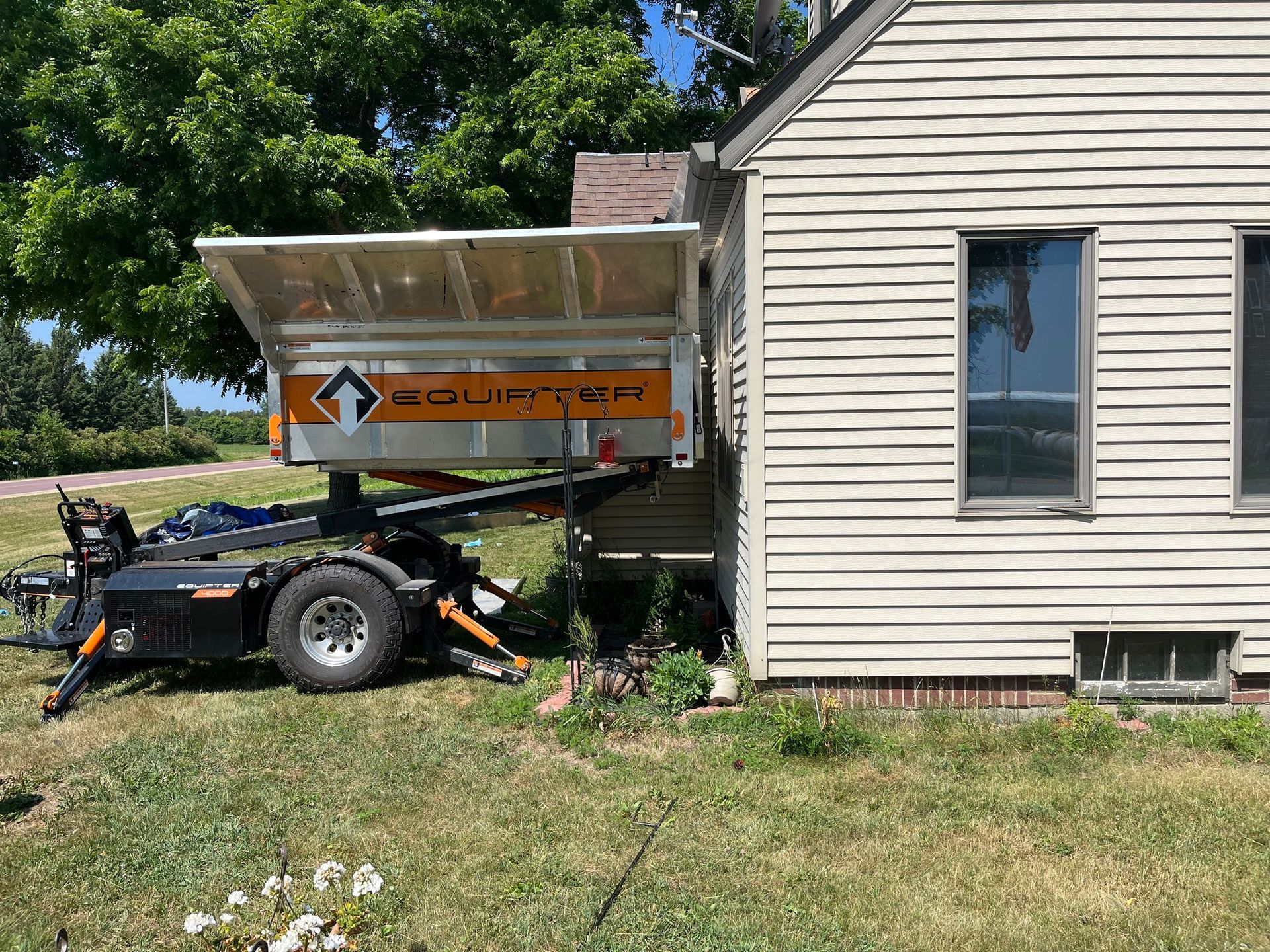 a dumpster in front of a house