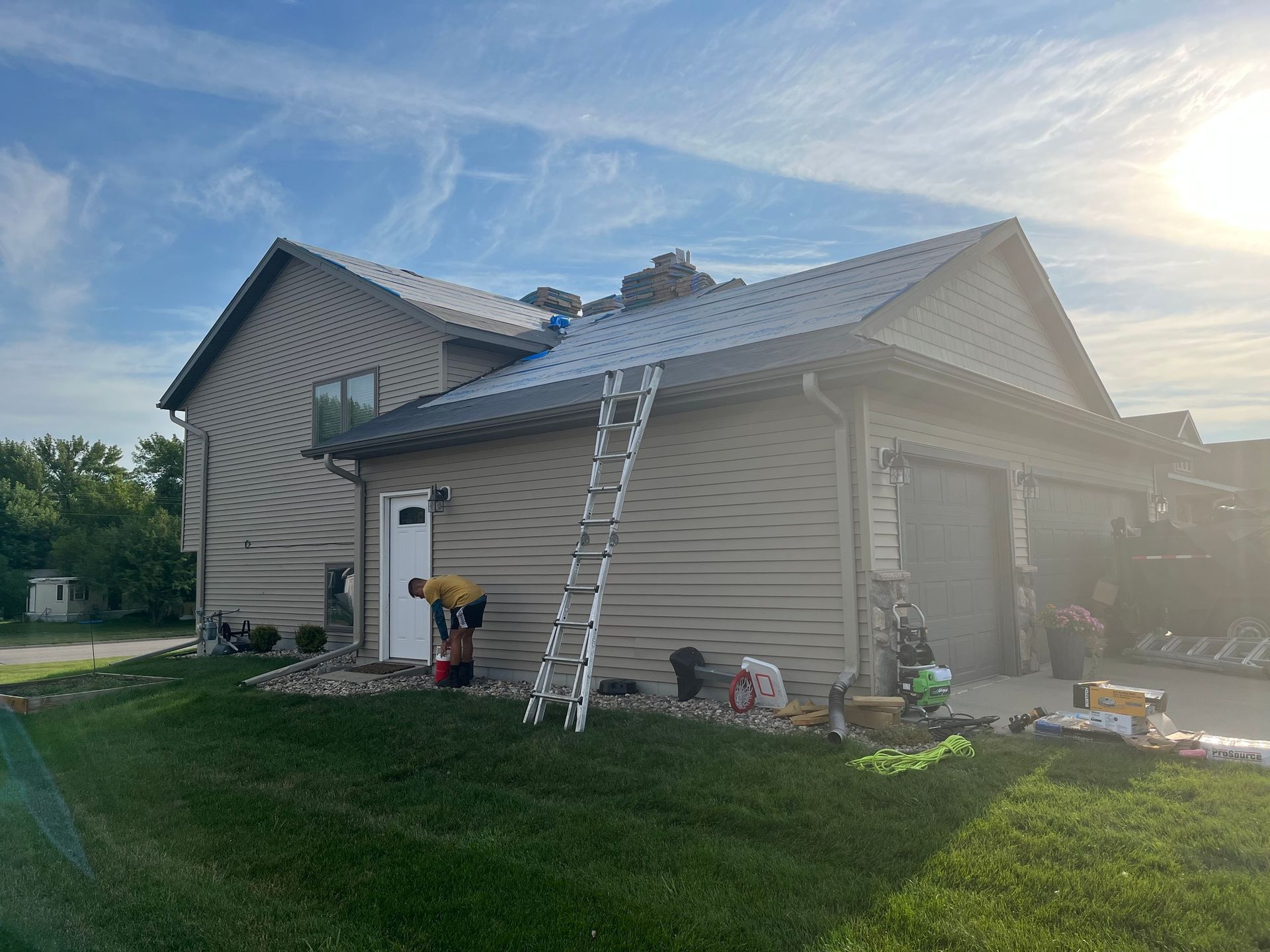 a ladder is sitting on the side of a house
