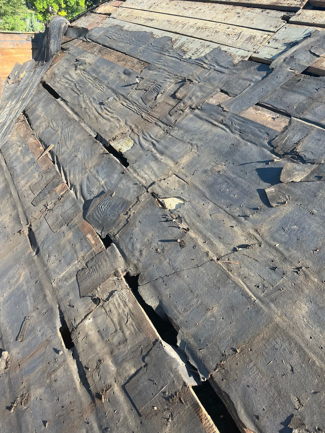 a close up of a roof with holes in it