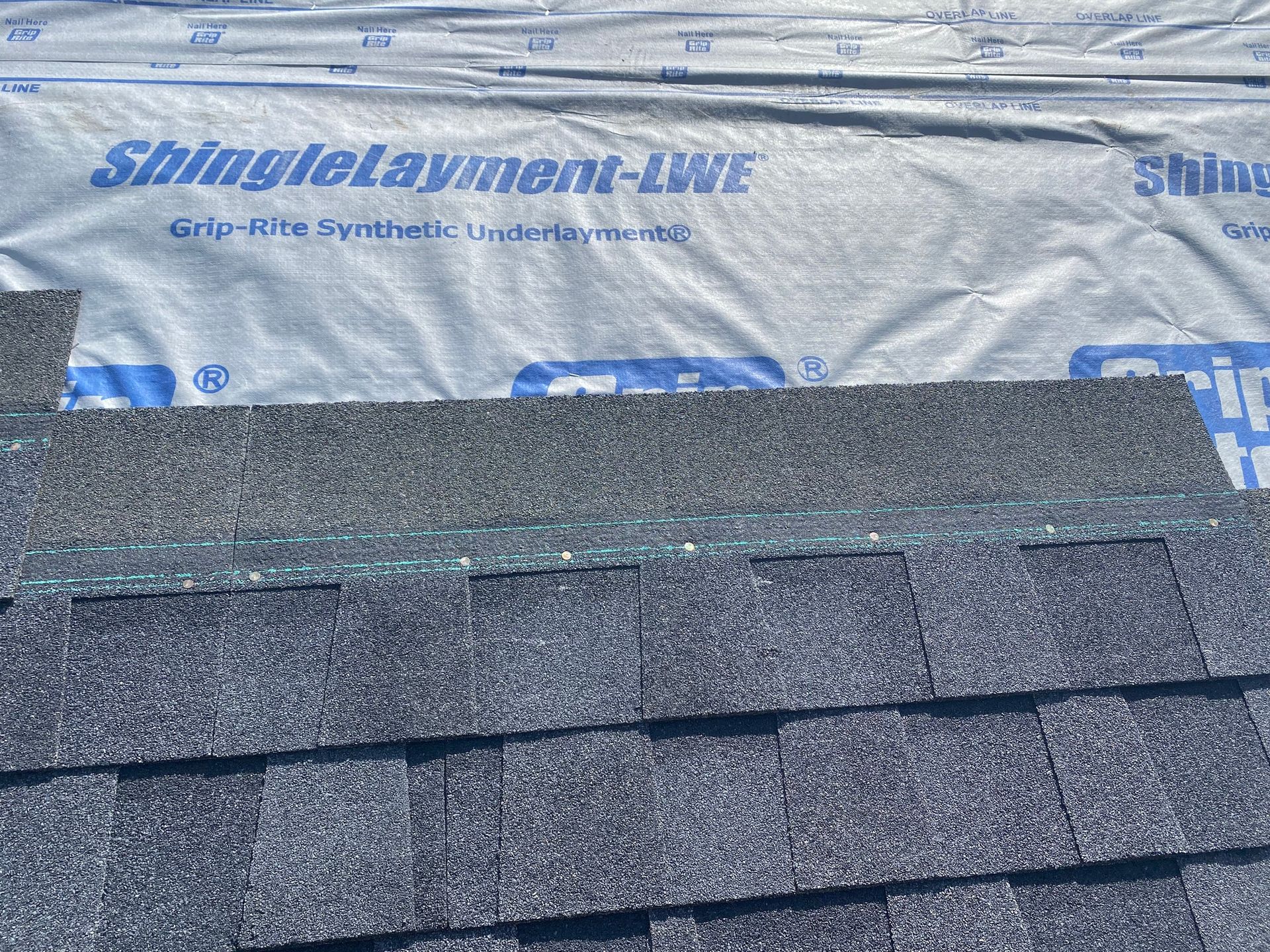 a close up of a roof with shingles on it
