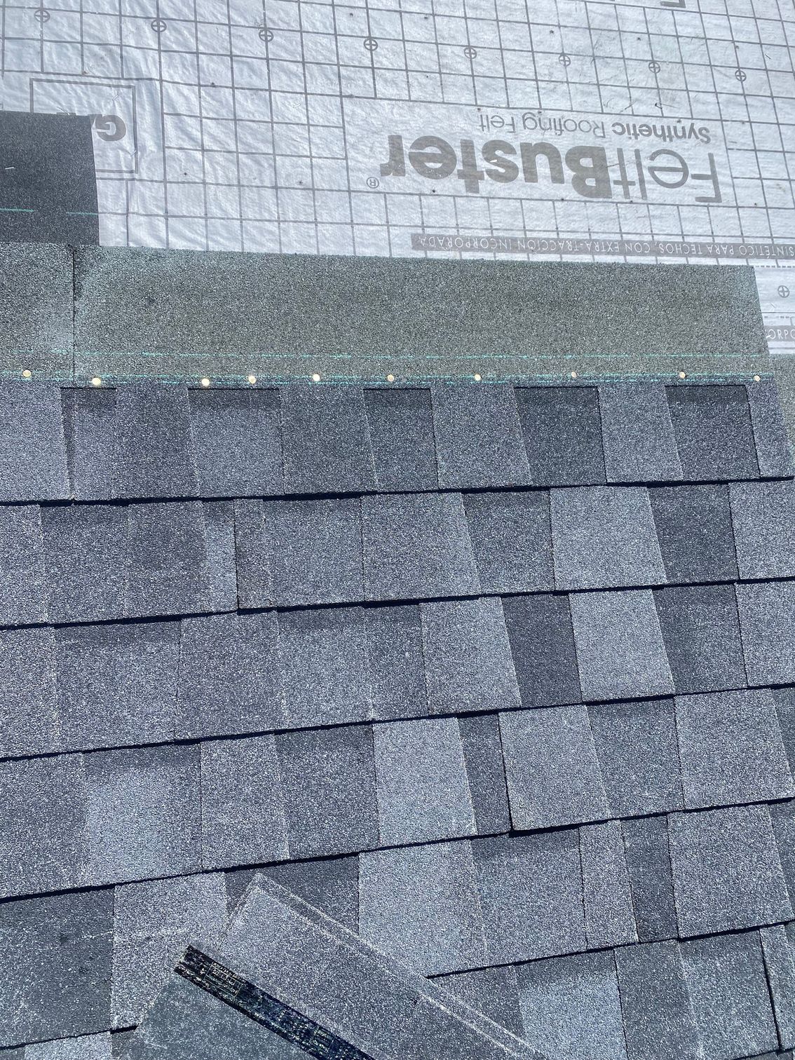a close up of a roof with shingles on it