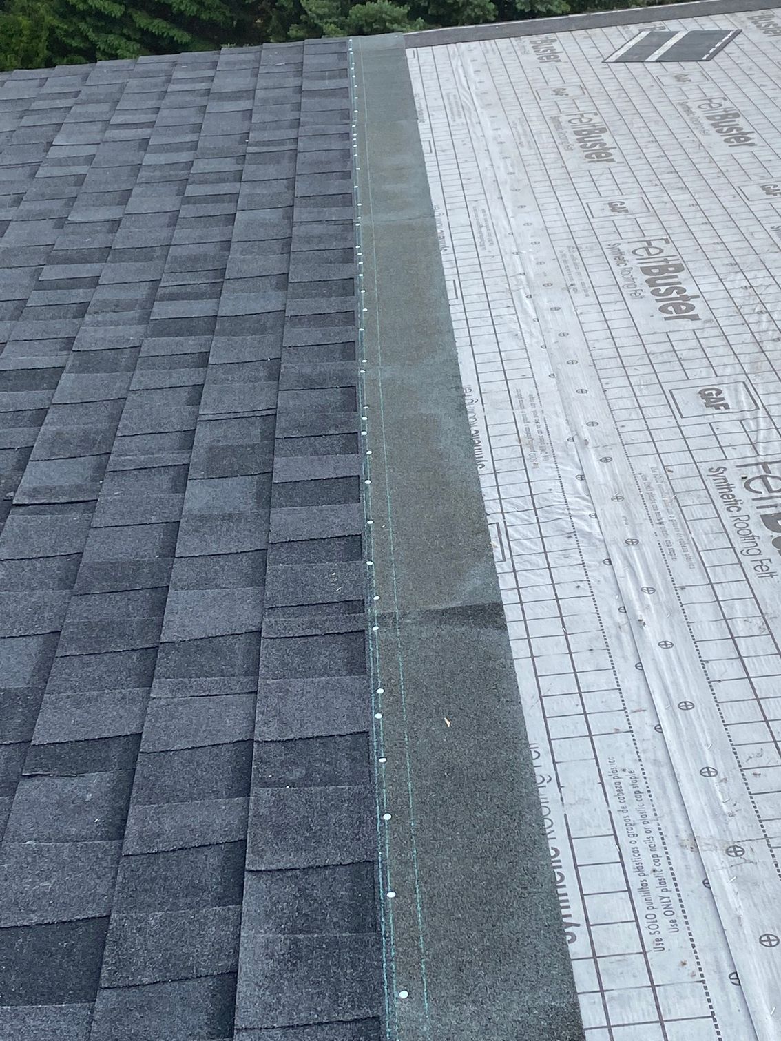 a close up of a roof with shingles on it