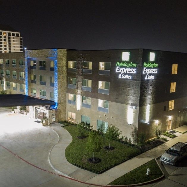 An aerial view of a holiday inn express hotel at night