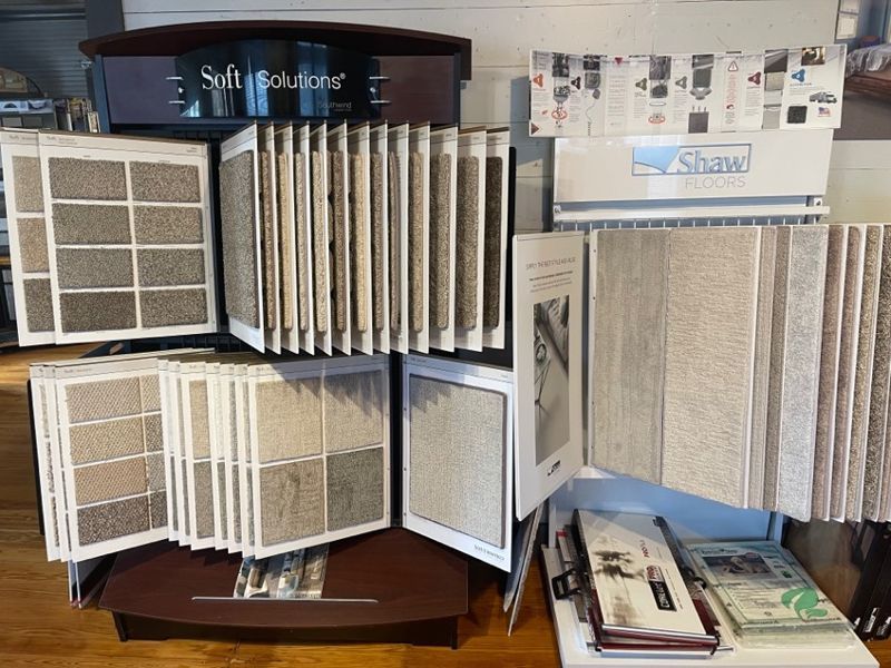 A display of carpets and tiles in a store.