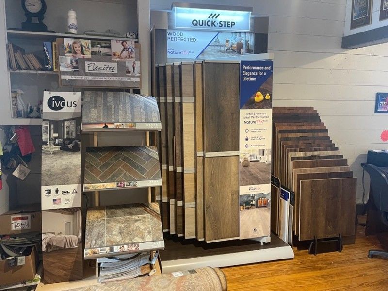 There are many different types of flooring on display in this room.