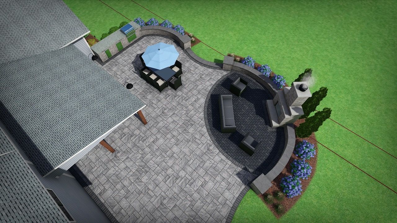 Overhead view of a home's backyard patio with seating, landscaping, and a blue umbrella.