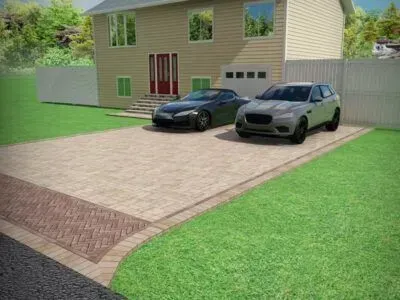 Driveway with two cars parked in front of a house; brickwork border with green lawn.