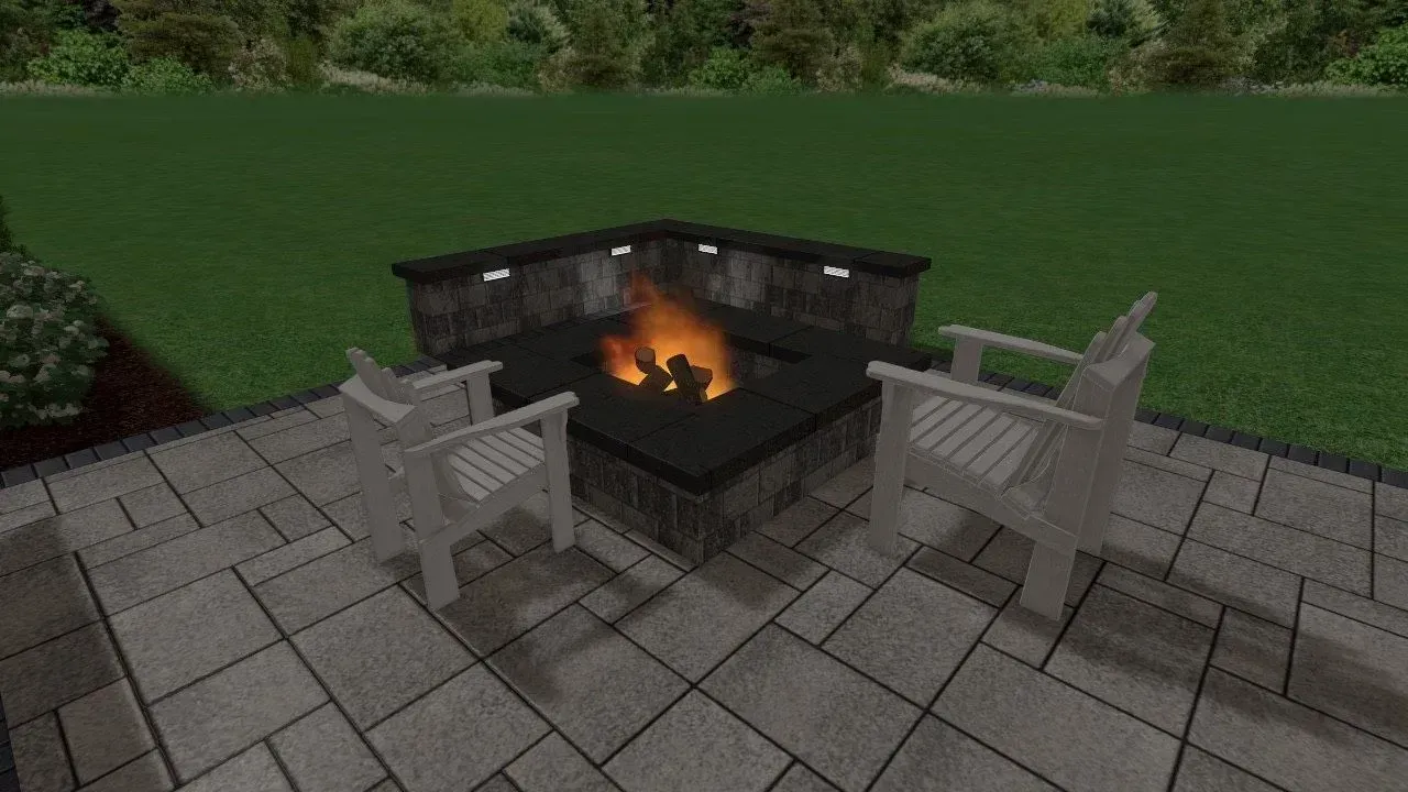 Two white chairs face a lit fire pit on a stone patio in a backyard setting.