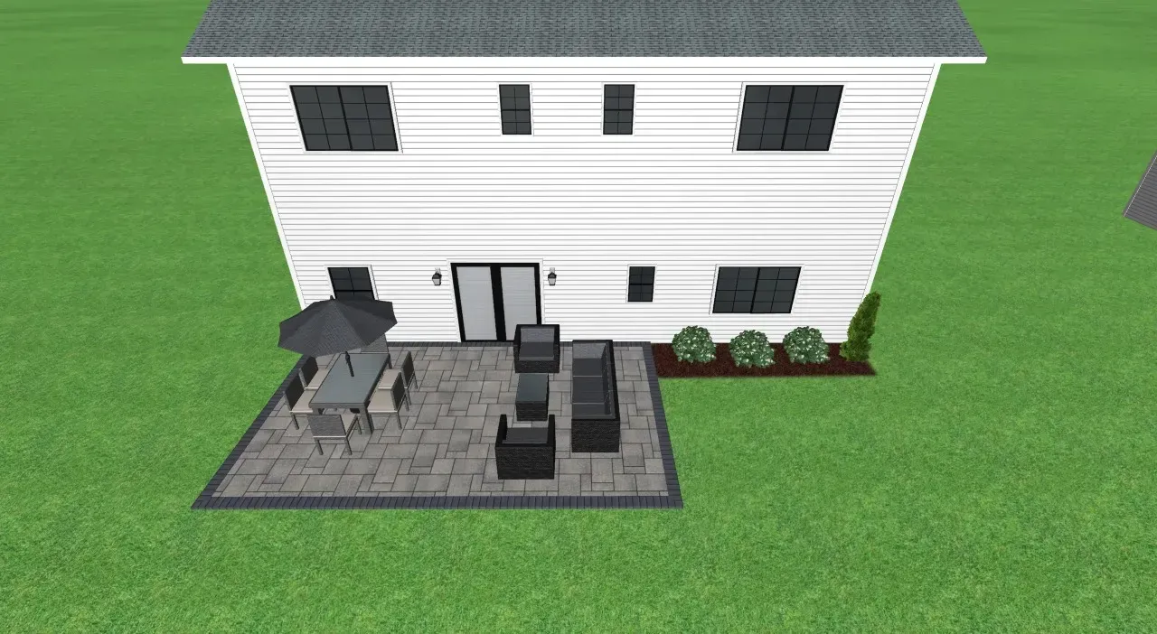Backyard patio with outdoor furniture, next to a white house with black window shutters and a green lawn.