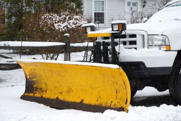 White Truck Plowing Snow