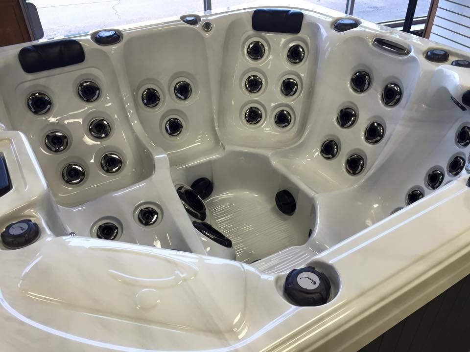 A white hot tub with a lot of holes in it