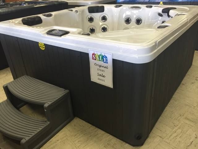 A hot tub with a sign that says sale on it
