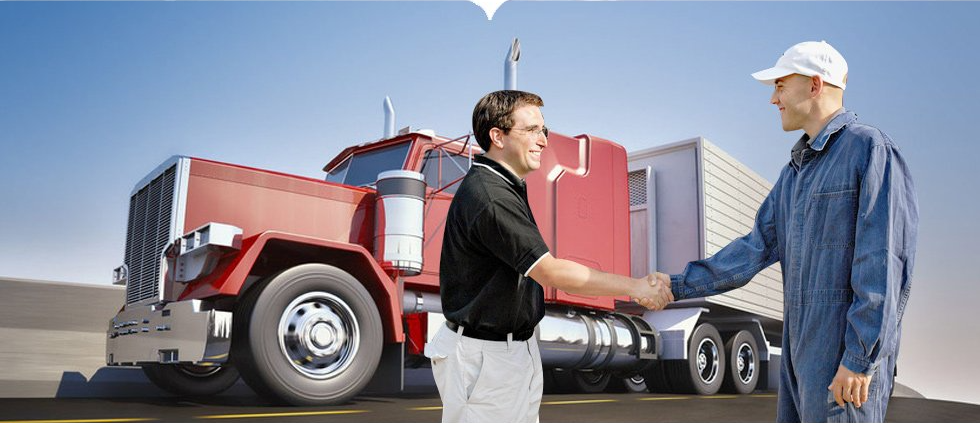 truck driver shaking hands with a middle aged guy with a truck behind