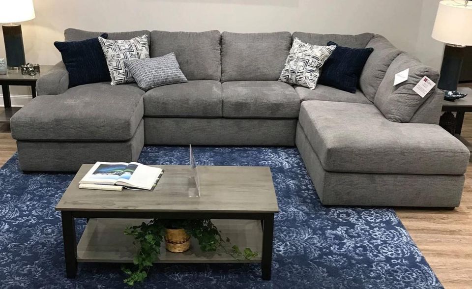 Dark grey sectionals with wood and metal table