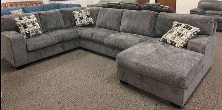 Gray sectional with chaise and pillows