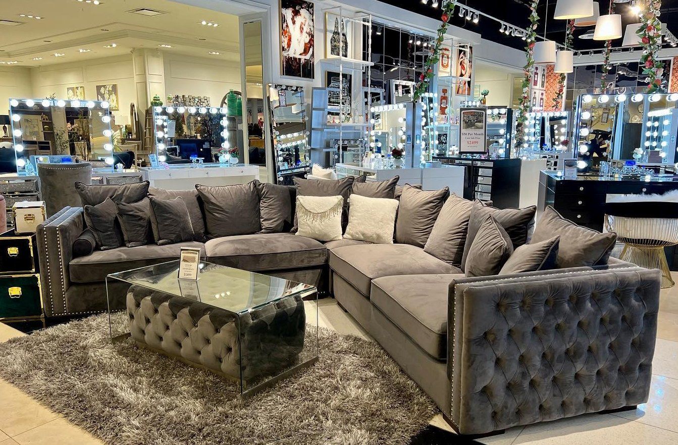 Dark brown fabric sectionals with glass table