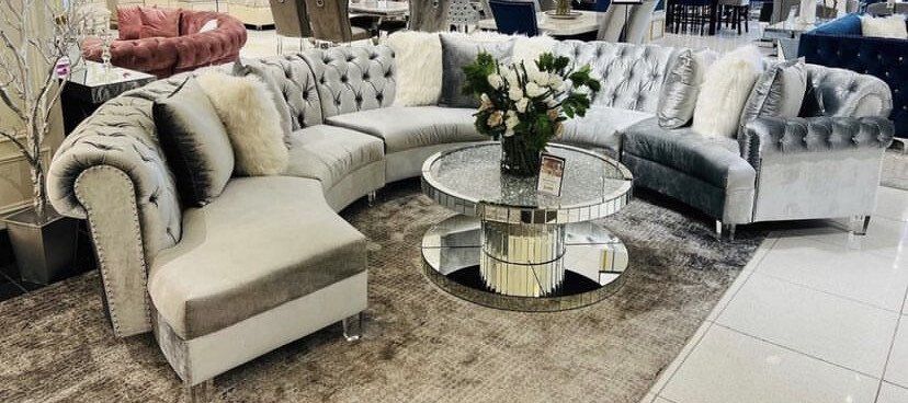 Fabric sectional in half circle shape with glass center table