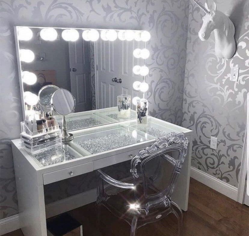 White vanity table with silver decorations and elegant chair
