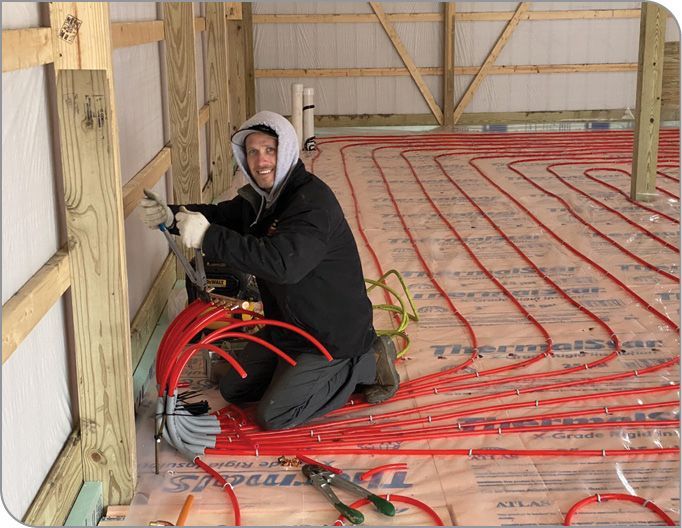 In-floor radiant heat warming a modern barndominium concrete floor