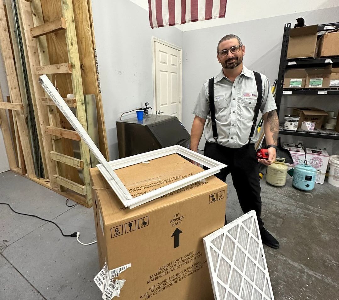 A man is standing next to a box in a room.