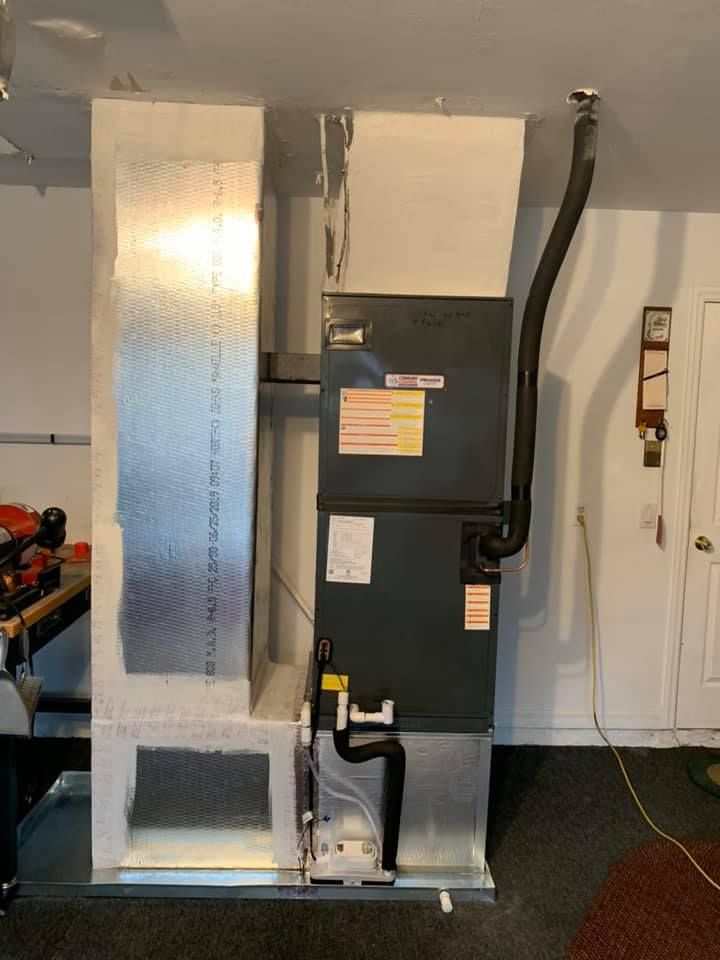 A heating and cooling system is installed in a garage.