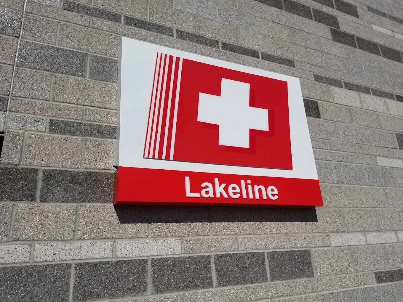 A lobby with a wooden counter that says