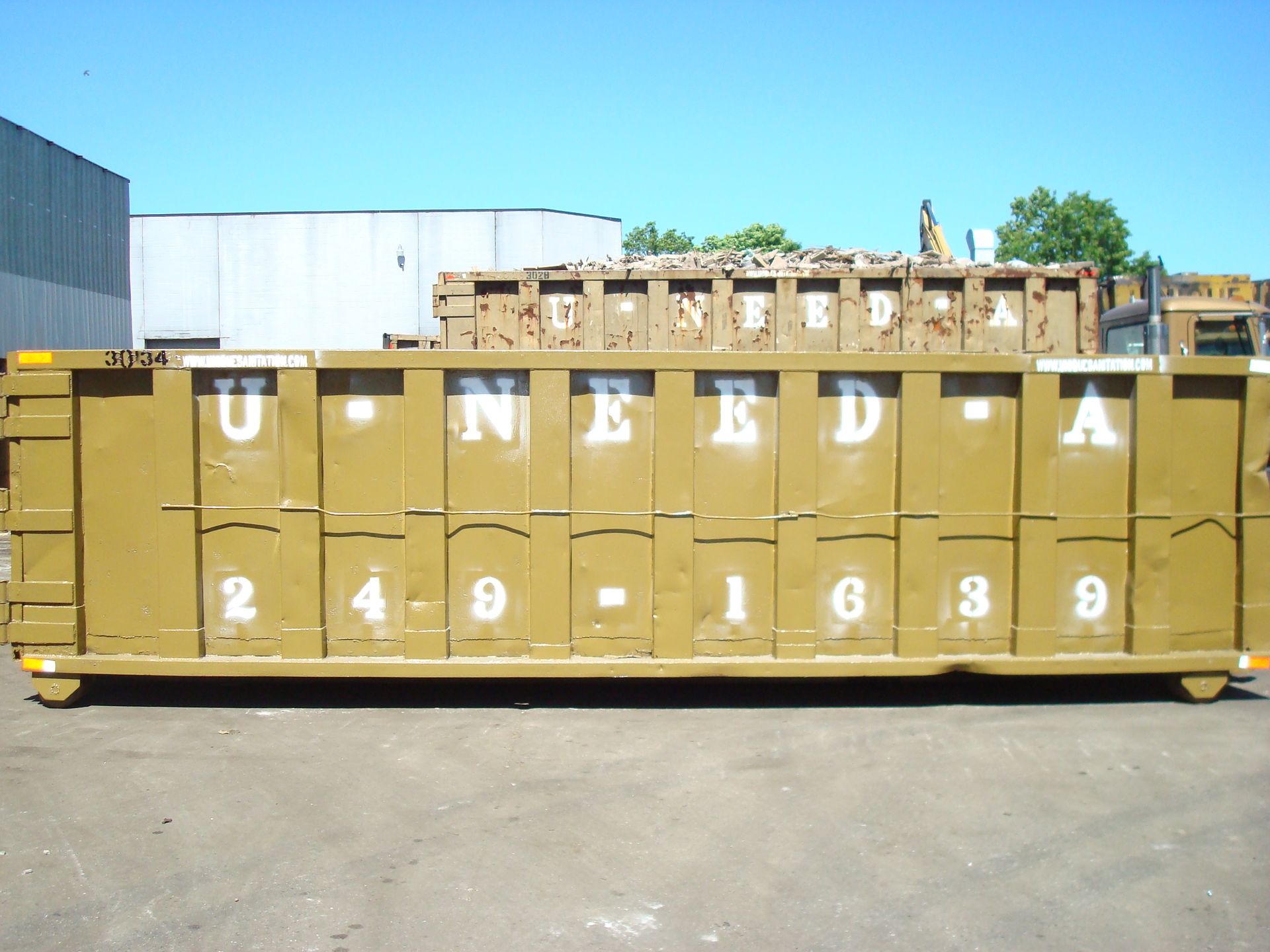 A large dumpster that says u need a on it