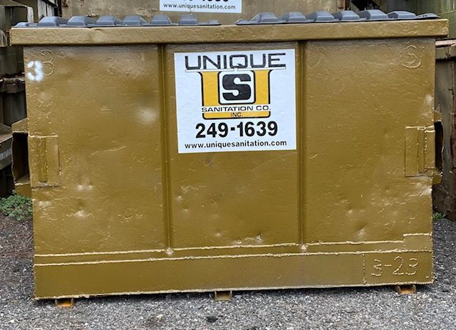 A dumpster with the number 3 on it
