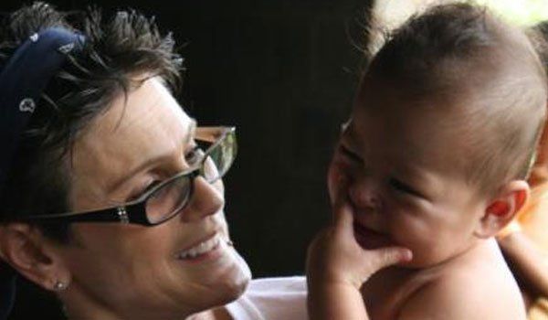 Nidia Walkup with a child