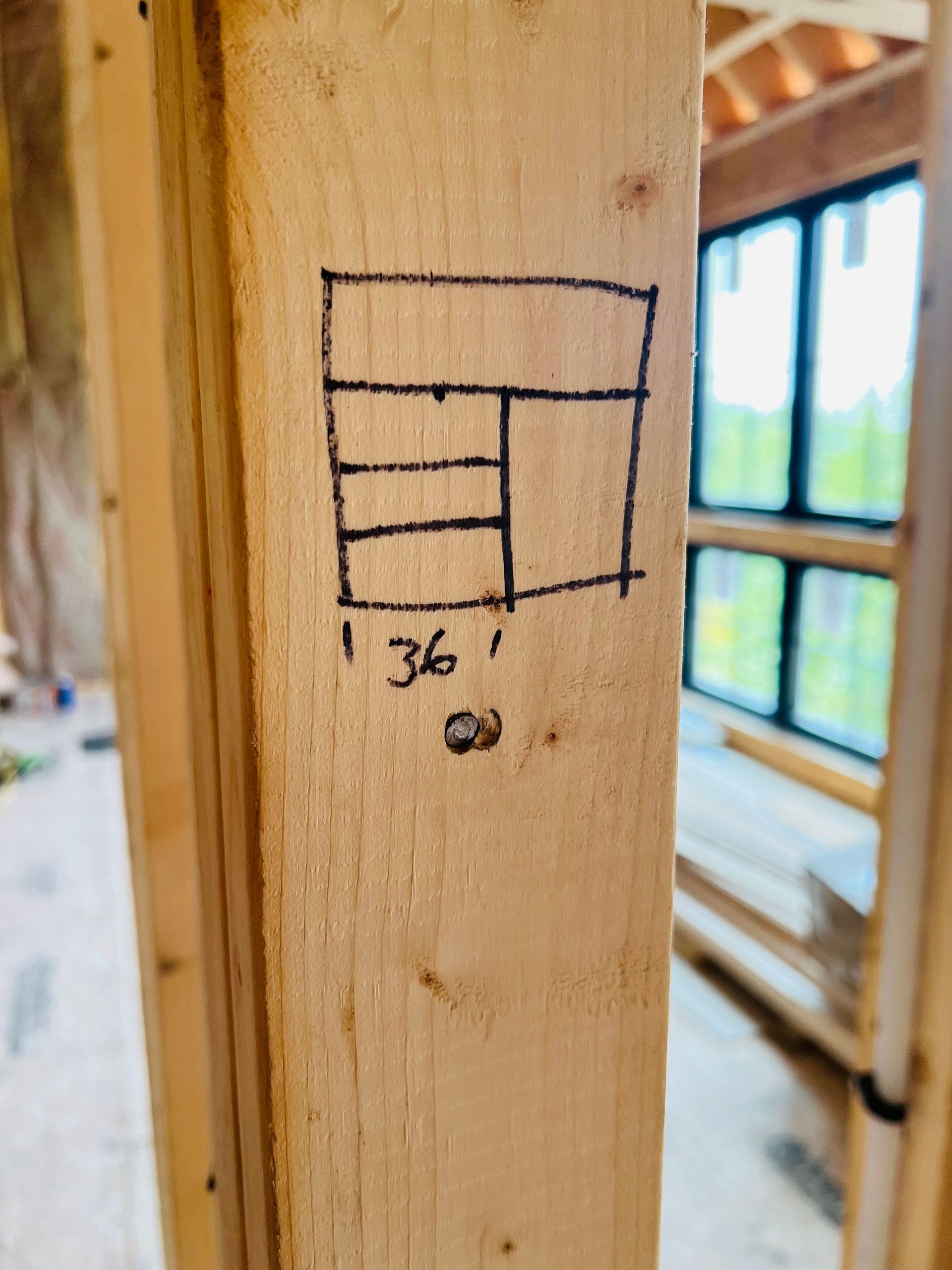 Diagram drawn on a wooden beam, labeled 