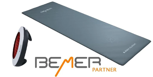 A bemer partner logo next to a yoga mat