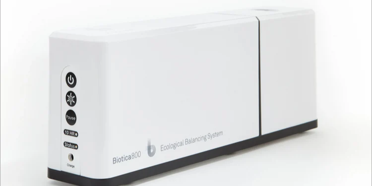 A white box with black buttons on it is sitting on a white surface.