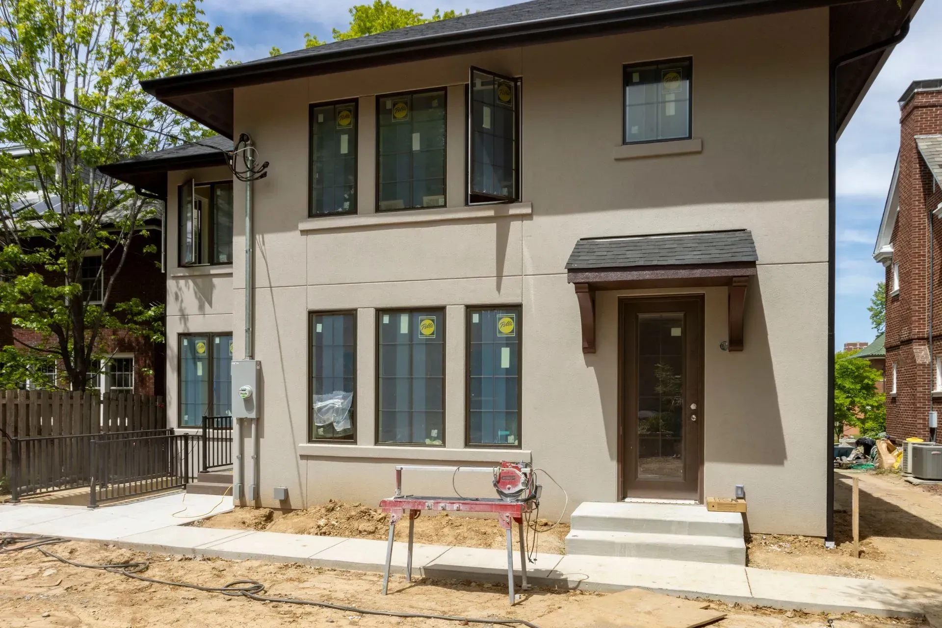 A house under construction with a table in front of it.