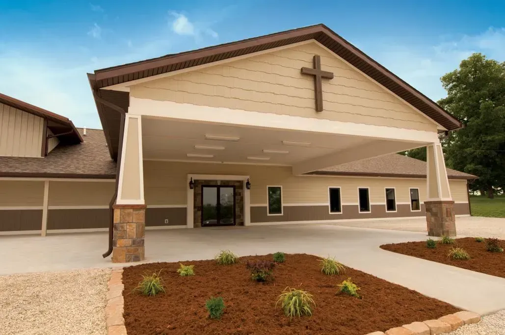 A church with a cross on the front of it