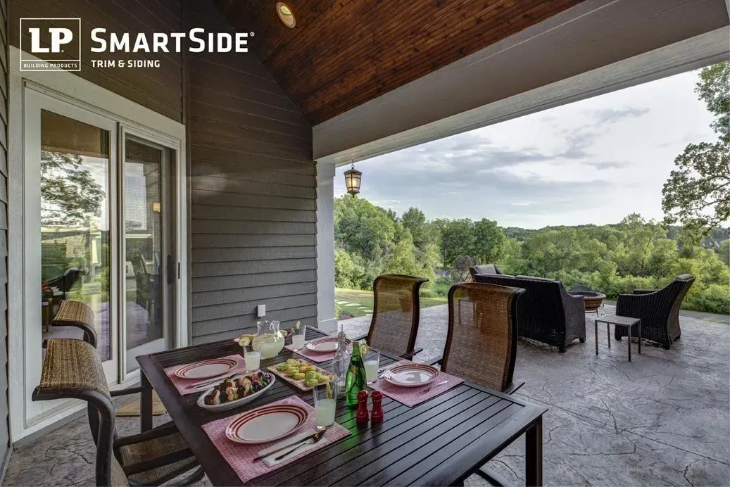 A patio with a table and chairs and a sign that says lp smart side
