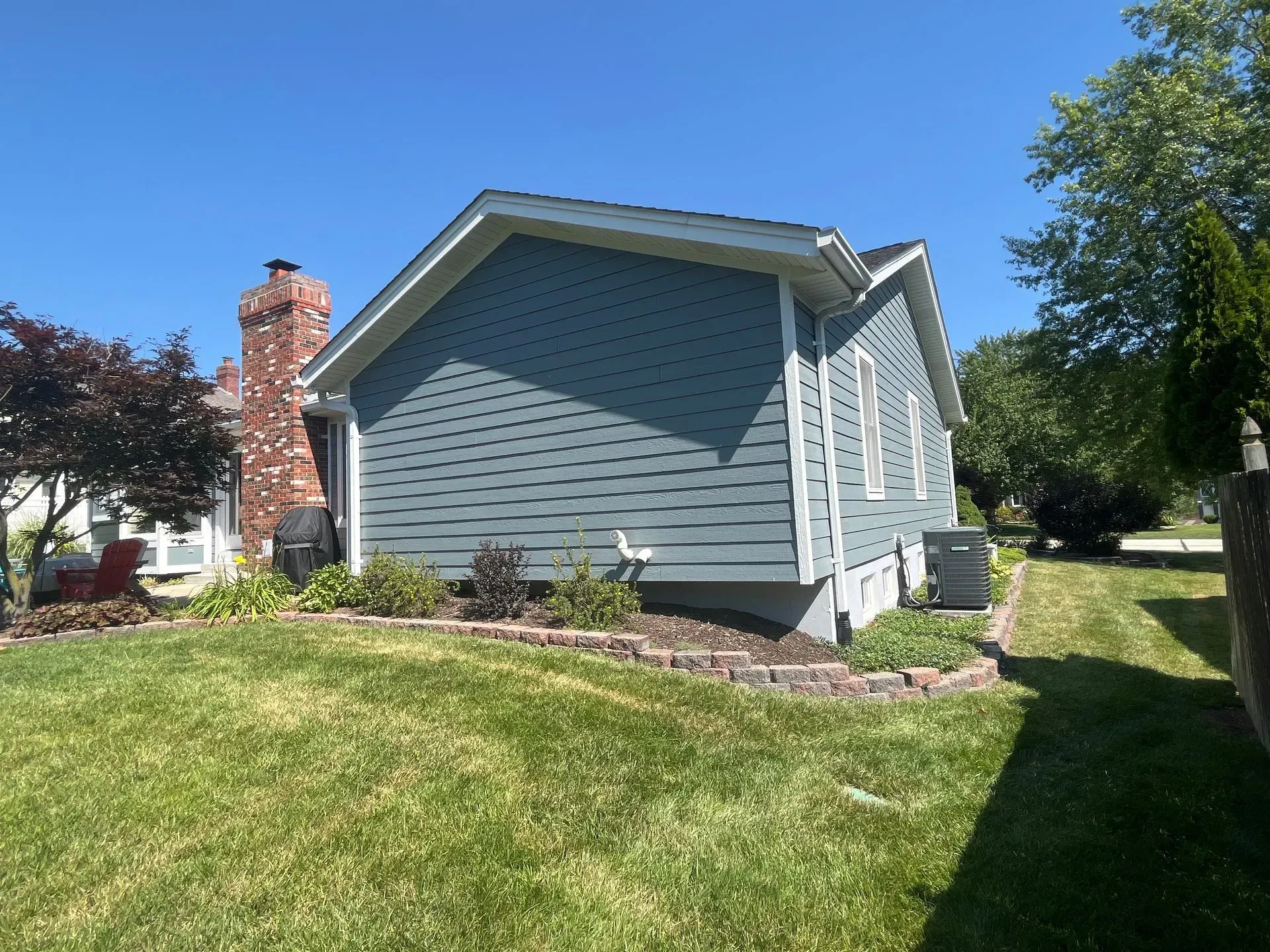 A house with a chimney on the side of it